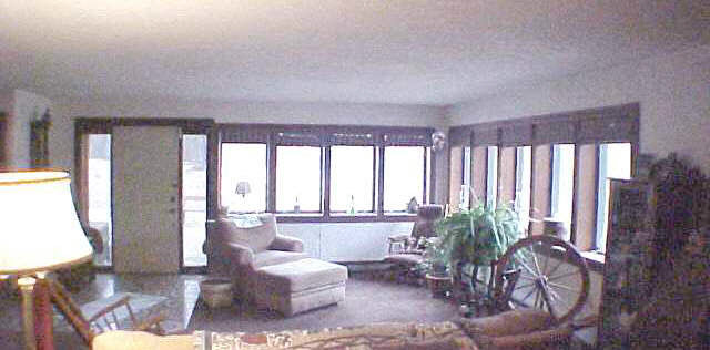 1262 East Brick Road Oregon, IL 61061 - Photo 4 of 6 a living room with furniture and a large window