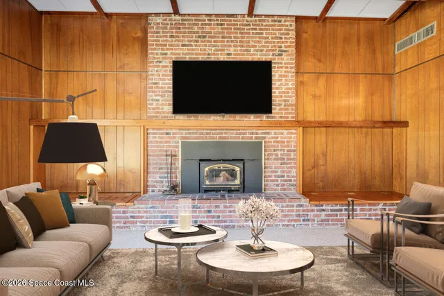 a view of an empty room with glass door