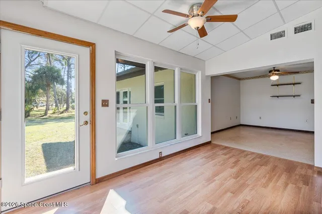 a kitchen with stainless steel appliances sink cabinets and window