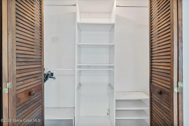 a view of a house with backyard sitting area and garden