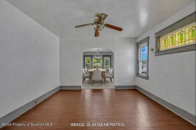 a bathroom with a sink a window and shower