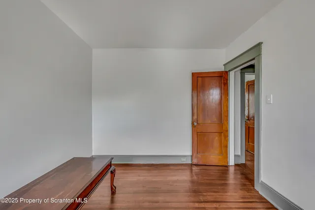 a bathroom with a sink a window and shower