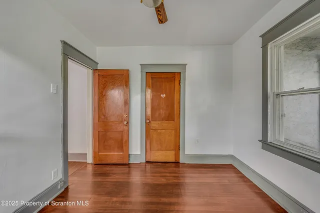 a bathroom with a granite countertop sink and washing machine