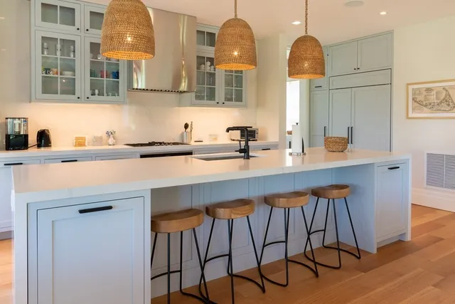 a kitchen with a sink cabinets and window
