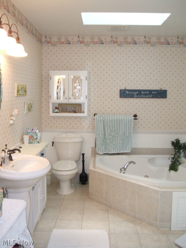 2118 North Medina Line Road Akron, OH 44333 - Photo 15 of 25 First floor master bath with Jacuzzi, tile floor and skylight