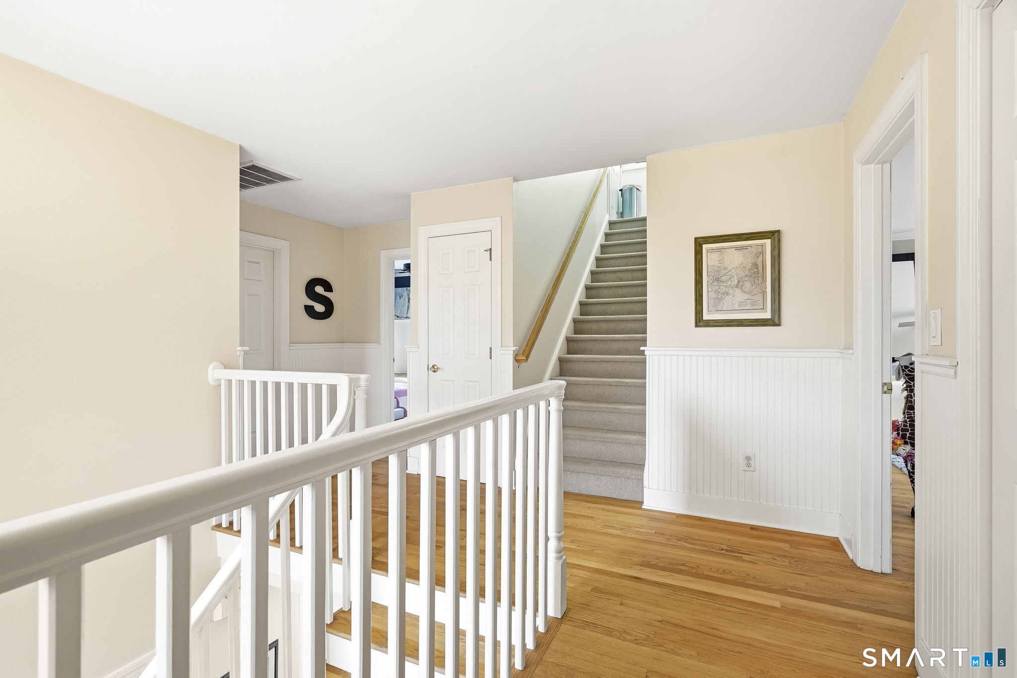 80 3rd Avenue Stratford, CT 06615 - Photo 22 of 40 a view of a hallway with wooden floor and windows