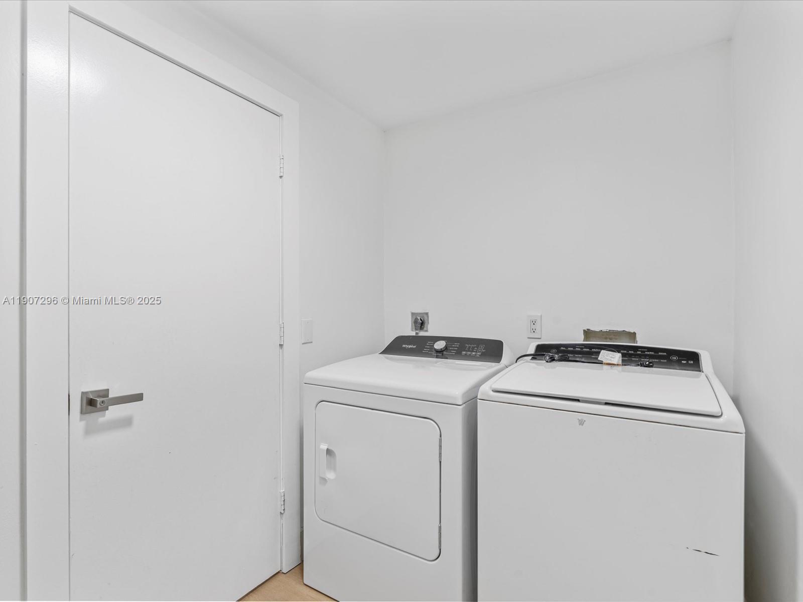 19461 Northeast 22nd Road North Miami Beach, FL 33179 - Photo 24 of 34 a utility room with dryer and washer