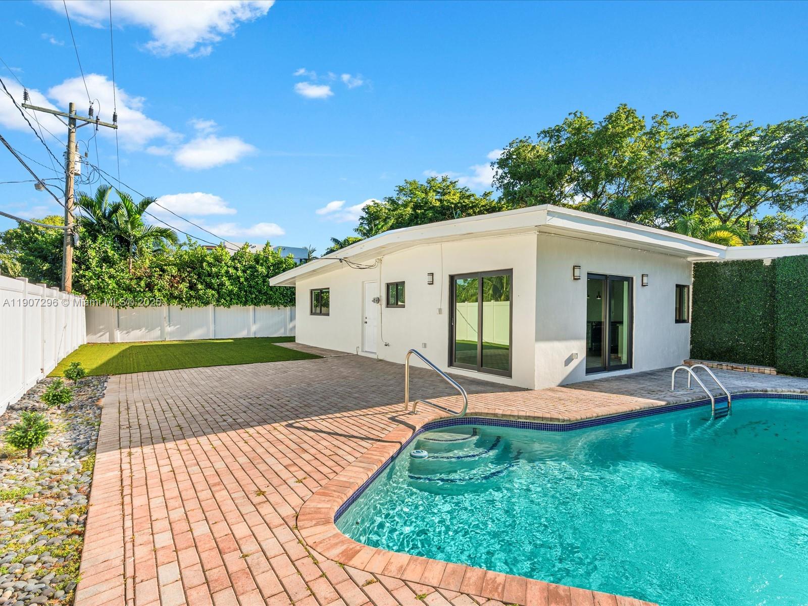 19461 Northeast 22nd Road North Miami Beach, FL 33179 - Photo 26 of 34 a view of a house with backyard and sitting area