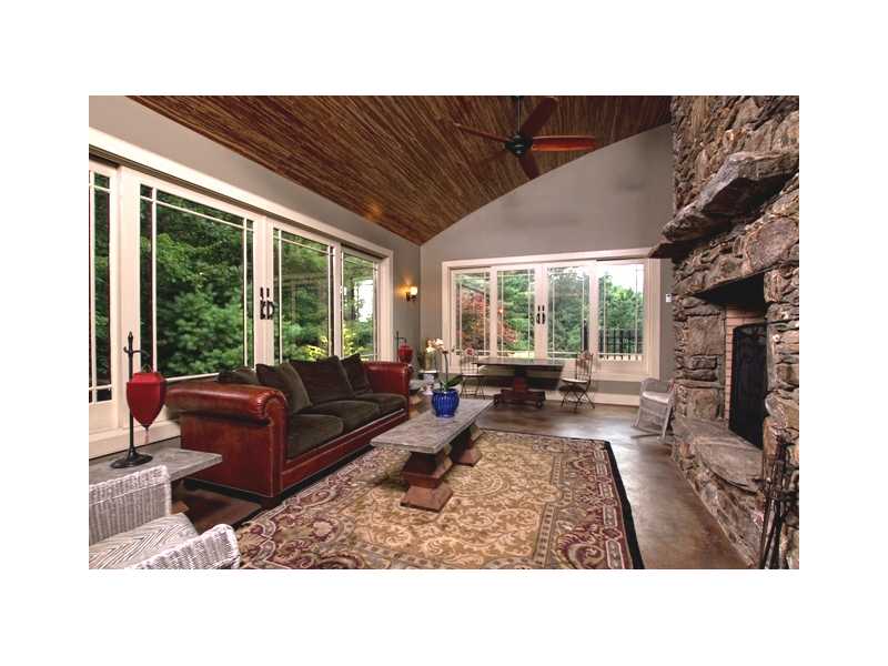 125 Pond House Road North Smithfield, RI 02896 - Photo 9 of 25 Other. Sunroom with stone fireplace