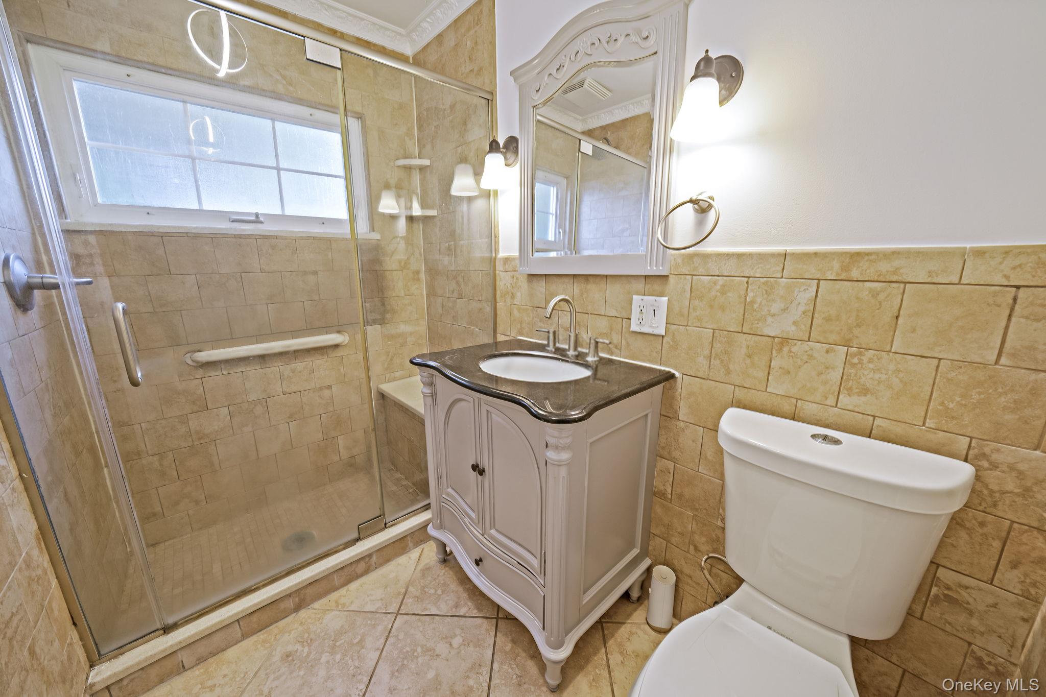 95 Lantern Road Hicksville, NY 11801 - Photo 21 of 36 a bathroom with a granite countertop toilet sink and shower