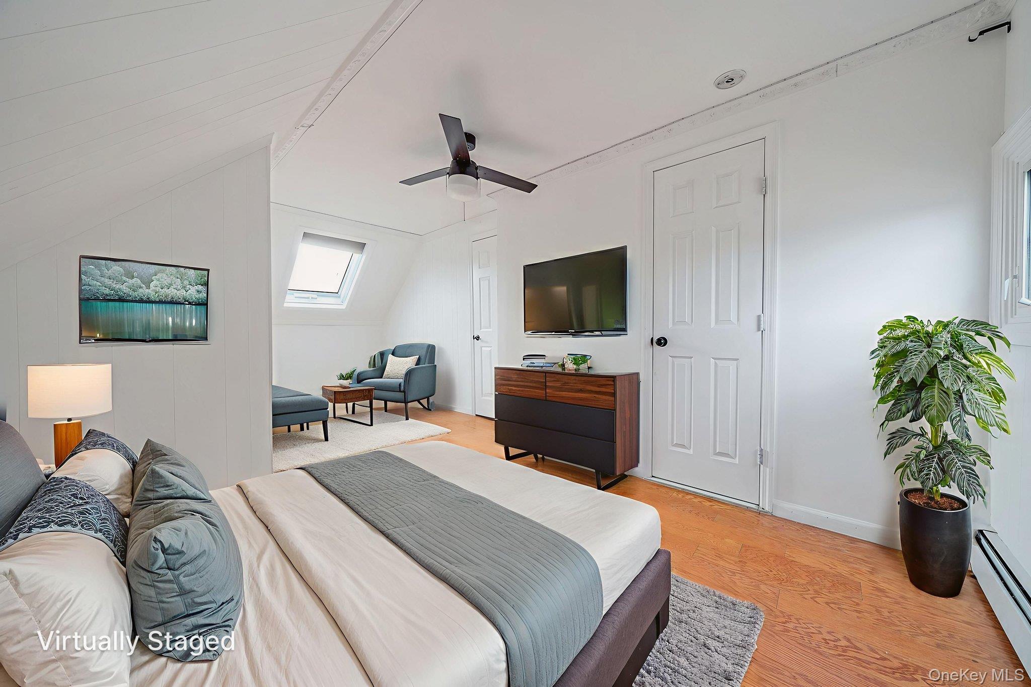 95 Lantern Road Hicksville, NY 11801 - Photo 24 of 36 a bedroom with a bed and a potted plant