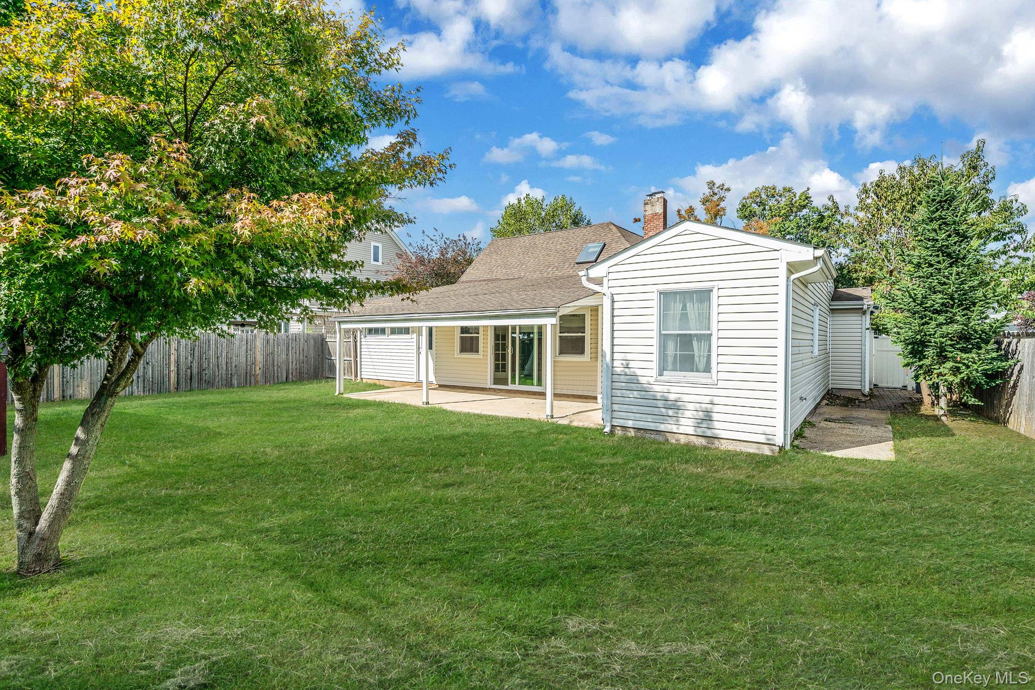 95 Lantern Road Hicksville, NY 11801 - Photo 35 of 36 a view of a house with a yard