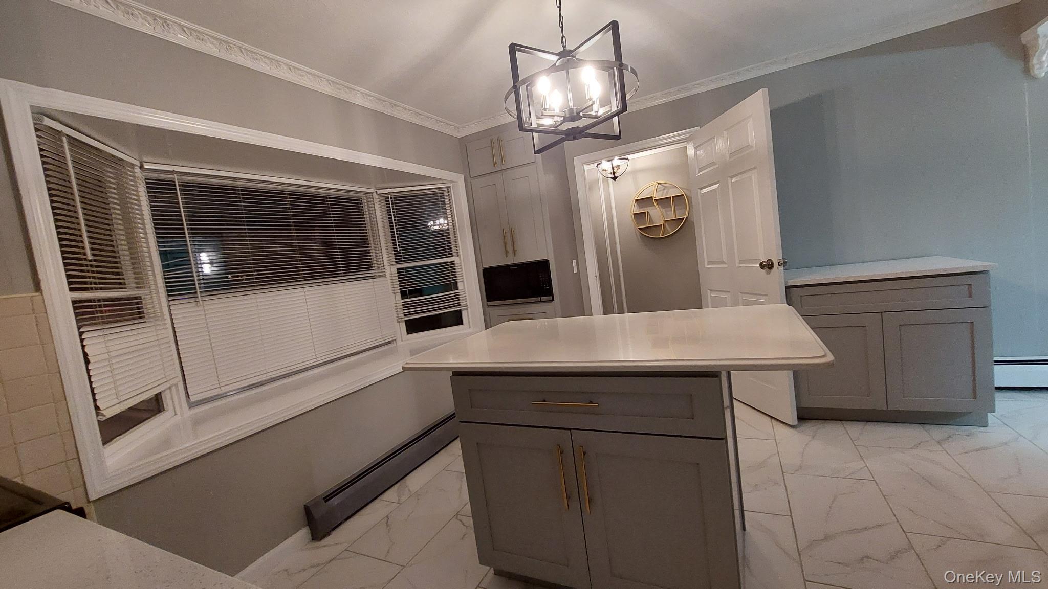 95 Lantern Road Hicksville, NY 11801 - Photo 7 of 36 a kitchen with a sink and refrigerator