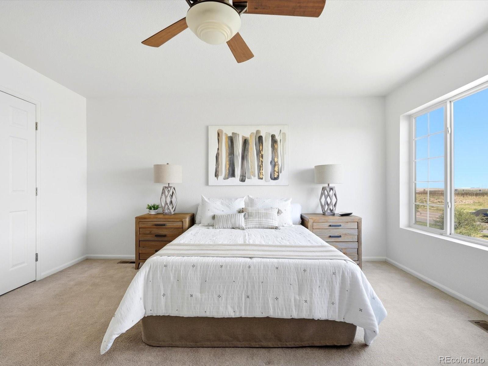 5444 Perth Court Denver, CO 80249 - Photo 25 of 46 a bedroom with a bed and window