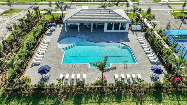 swimming pool view with a seating space