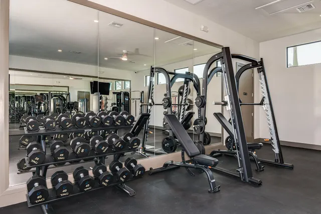 a dining room with furniture and a floor to ceiling window