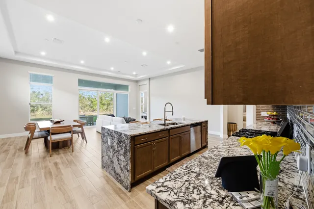 a kitchen with a sink and wooden cabinets
