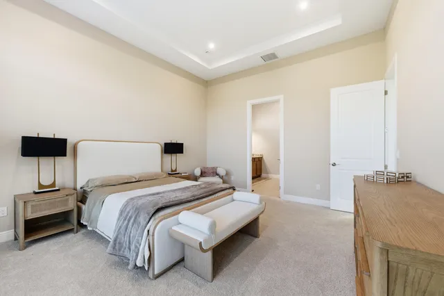 a bedroom with a bed and a couch