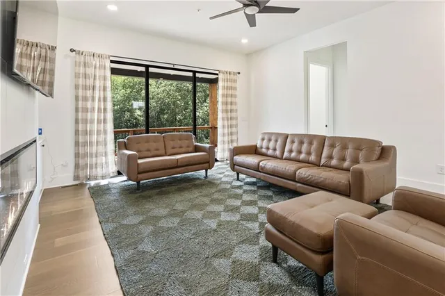 a kitchen with stainless steel appliances granite countertop a sink and a white cabinets