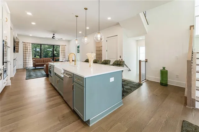 a white bath tub sitting next to a white sink