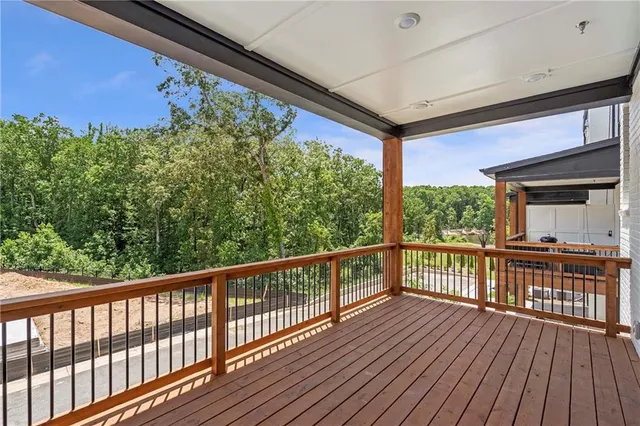 a bathroom with a sink a toilet and a large mirror
