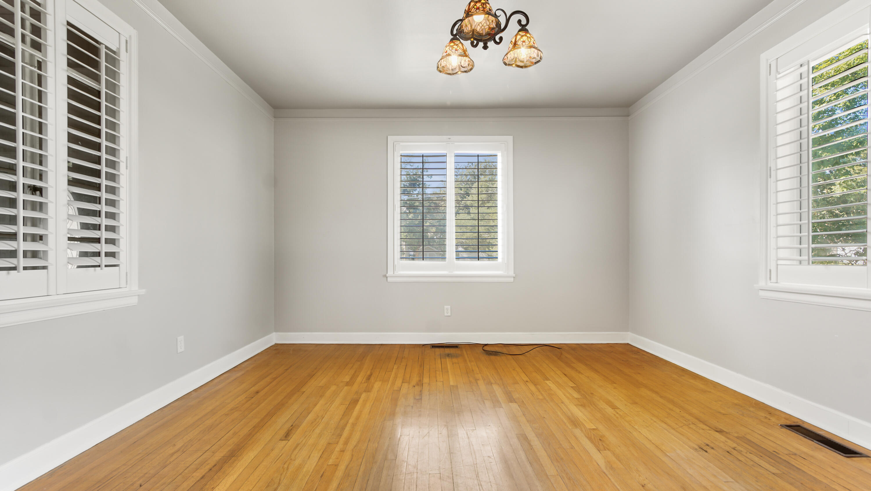 111 Bay Avenue DeFuniak Springs, FL 32435 - Photo 11 of 51 wooden floor in a room next to a window