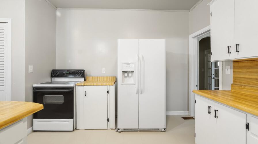 111 Bay Avenue DeFuniak Springs, FL 32435 - Photo 15 of 51 a kitchen with a stove and a refrigerator