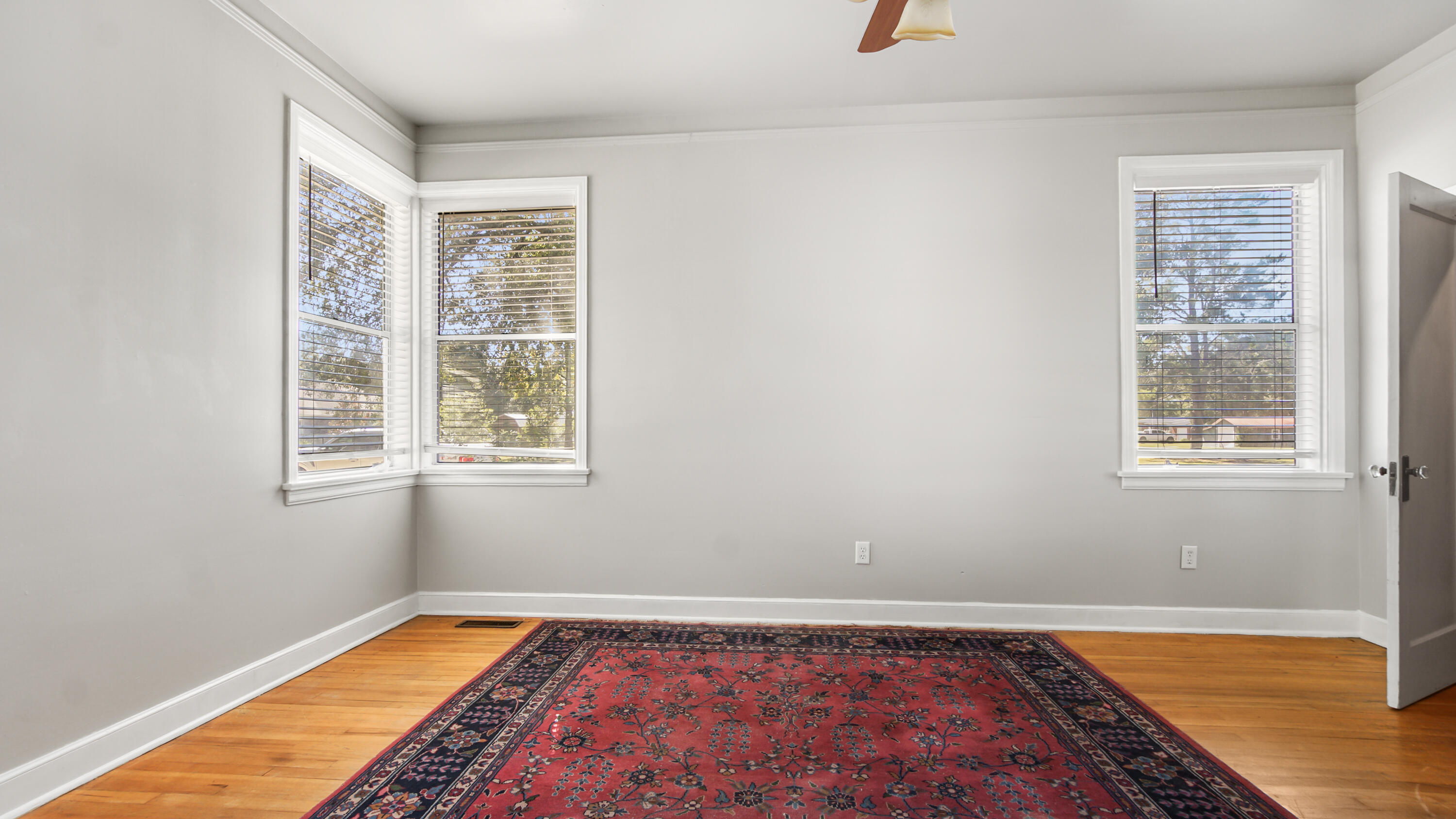 111 Bay Avenue DeFuniak Springs, FL 32435 - Photo 17 of 51 a view of a room with window and wooden floor