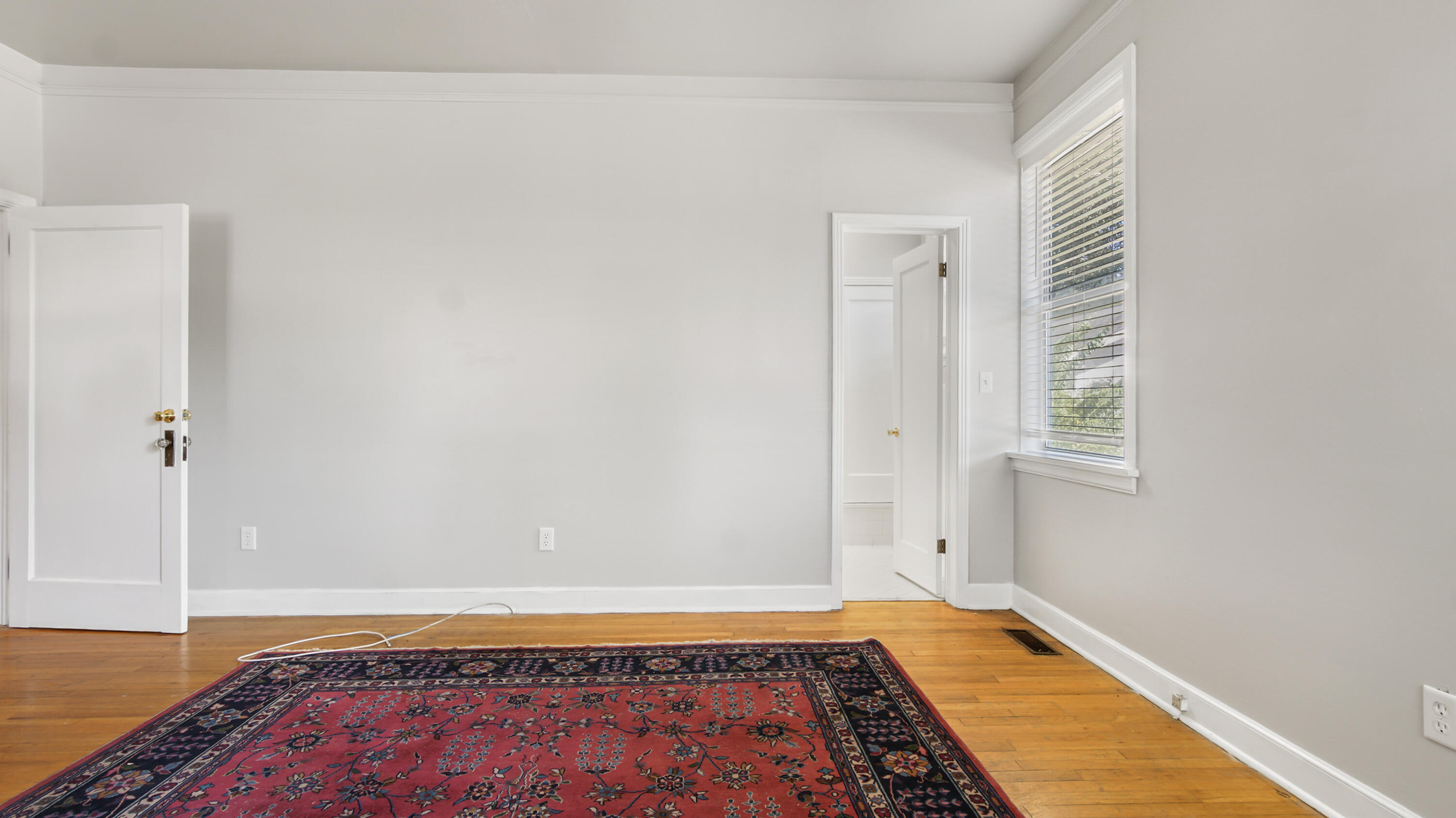 111 Bay Avenue DeFuniak Springs, FL 32435 - Photo 19 of 51 a view of a room with wooden floor and cabinet