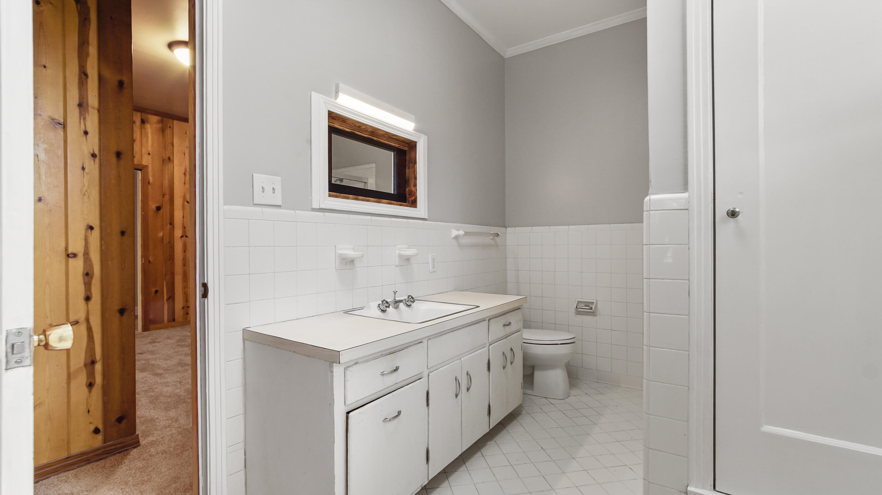 111 Bay Avenue DeFuniak Springs, FL 32435 - Photo 20 of 51 a bathroom with a toilet sink and mirror
