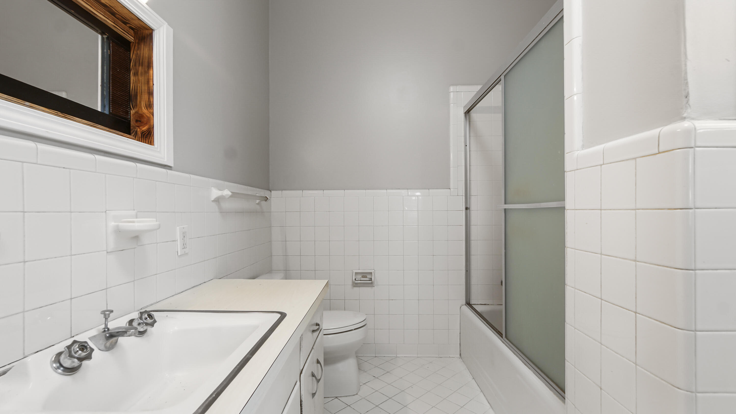 111 Bay Avenue DeFuniak Springs, FL 32435 - Photo 22 of 51 a bathroom with a sink a toilet and shower