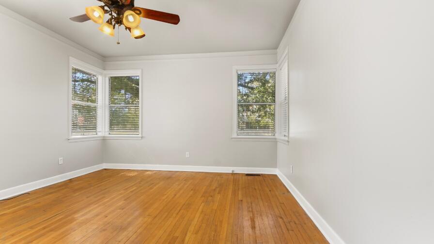 111 Bay Avenue DeFuniak Springs, FL 32435 - Photo 30 of 51 wooden floor in an empty room with a window