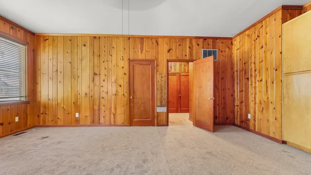 a view of a bathroom with wooden floor