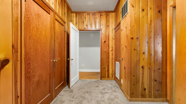 a view of a big room with wooden walls