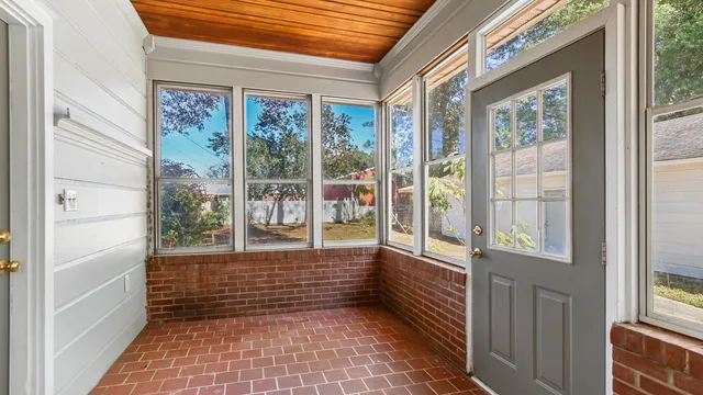 a view of a house with backyard sitting area and sitting area