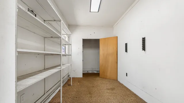 a view of a porch with wooden fence and floor