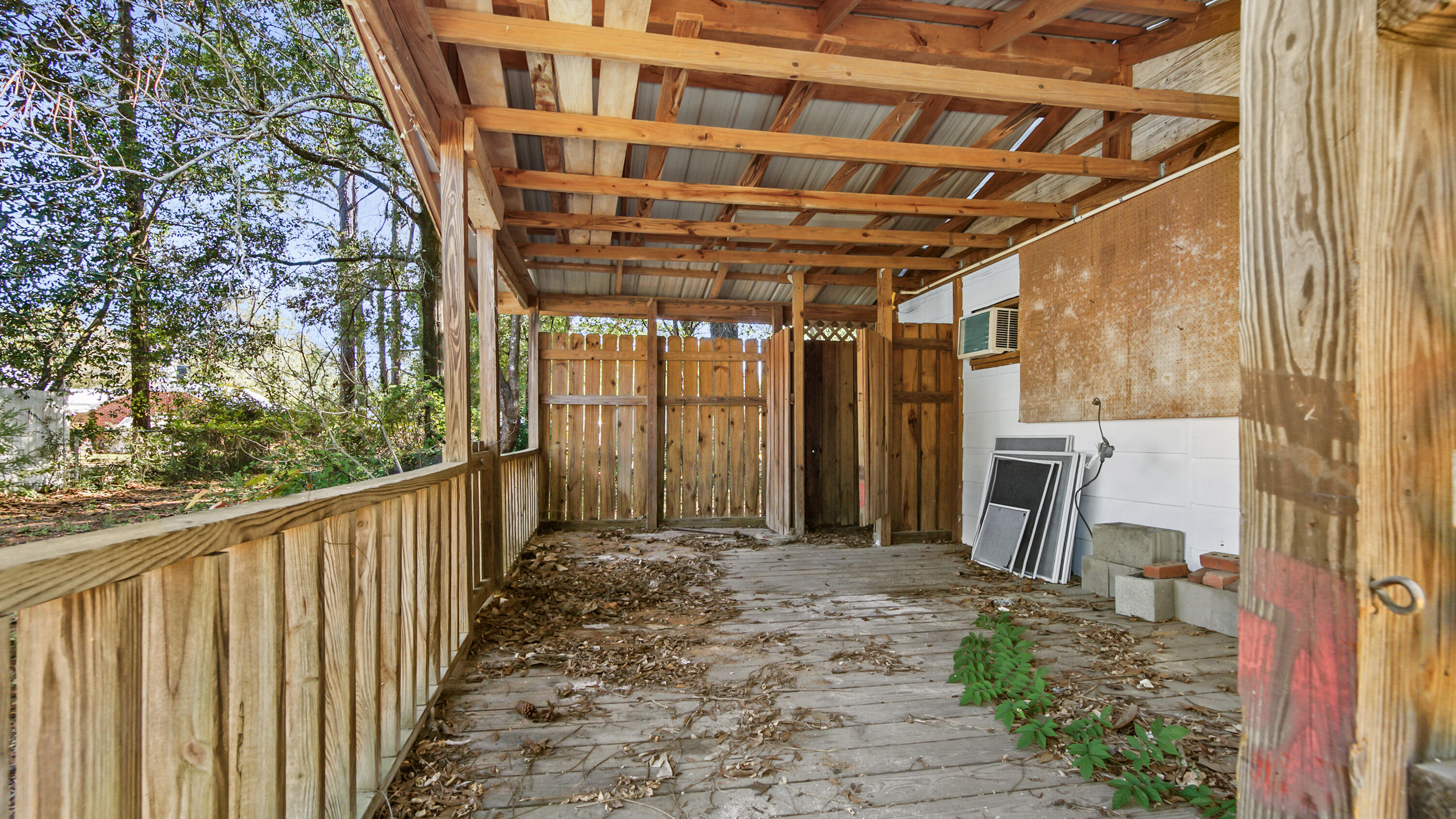 111 Bay Avenue DeFuniak Springs, FL 32435 - Photo 45 of 51 a view of a porch with wooden fence and floor