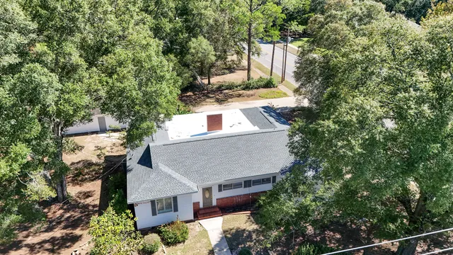 front view of a house with a tree