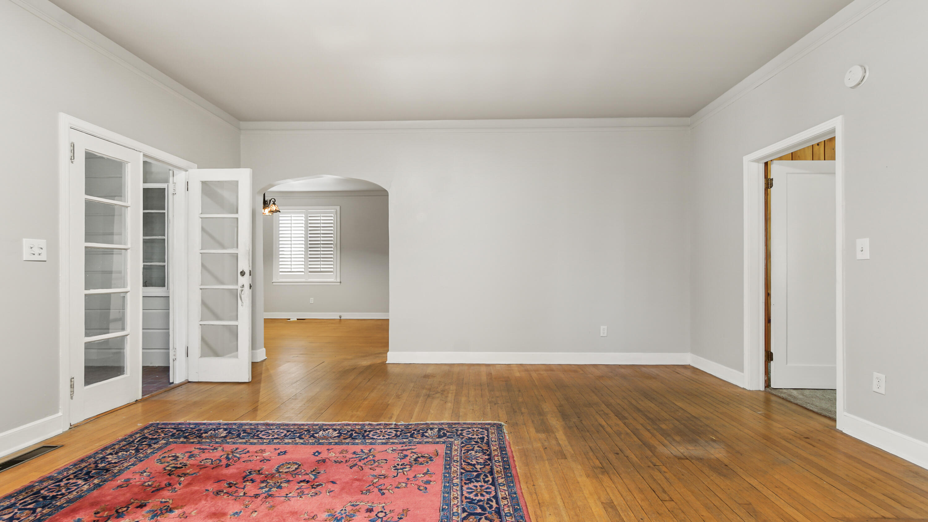 111 Bay Avenue DeFuniak Springs, FL 32435 - Photo 10 of 51 a view of an empty room with wooden floor and window