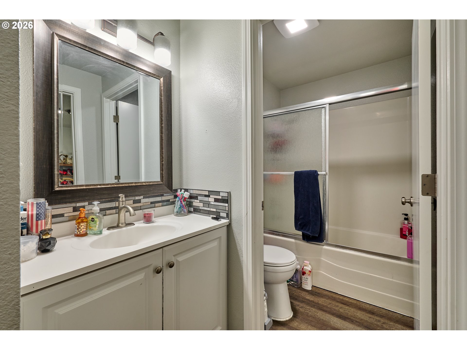 880 North Pershing Street Mount Angel, OR 97362 - Photo 23 of 30 a bathroom with a sink and a mirror