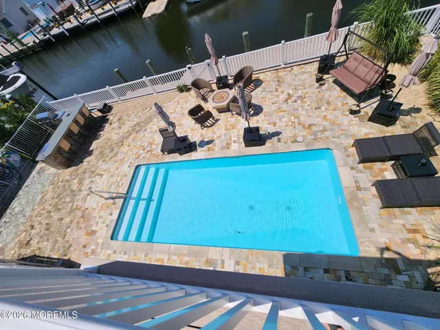 a view of a lake with boats and trees