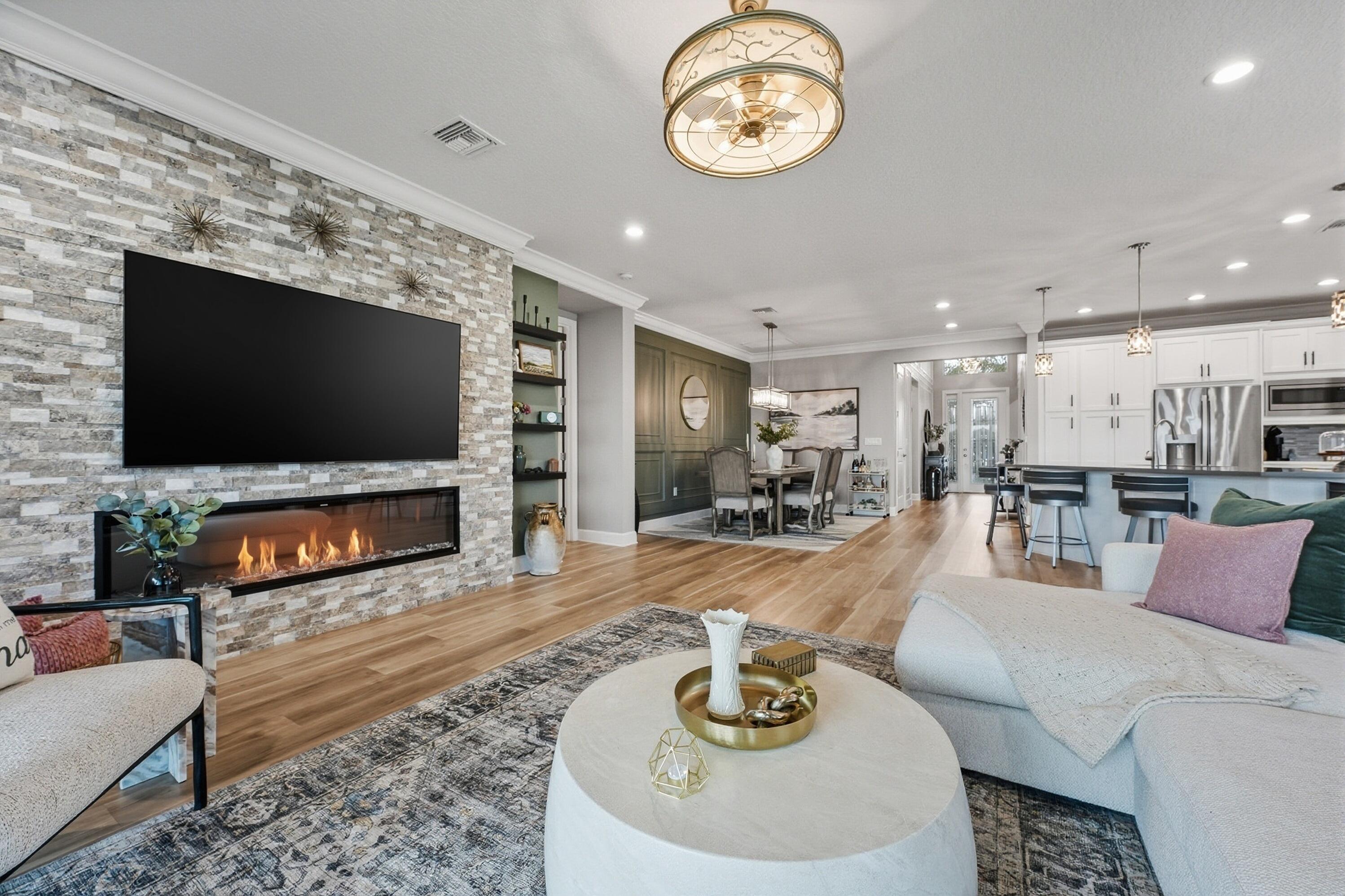 11784 Southwest Sailfish Isles Way Port St. Lucie, FL 34987 - Photo 11 of 77 a living room with furniture and a flat screen tv