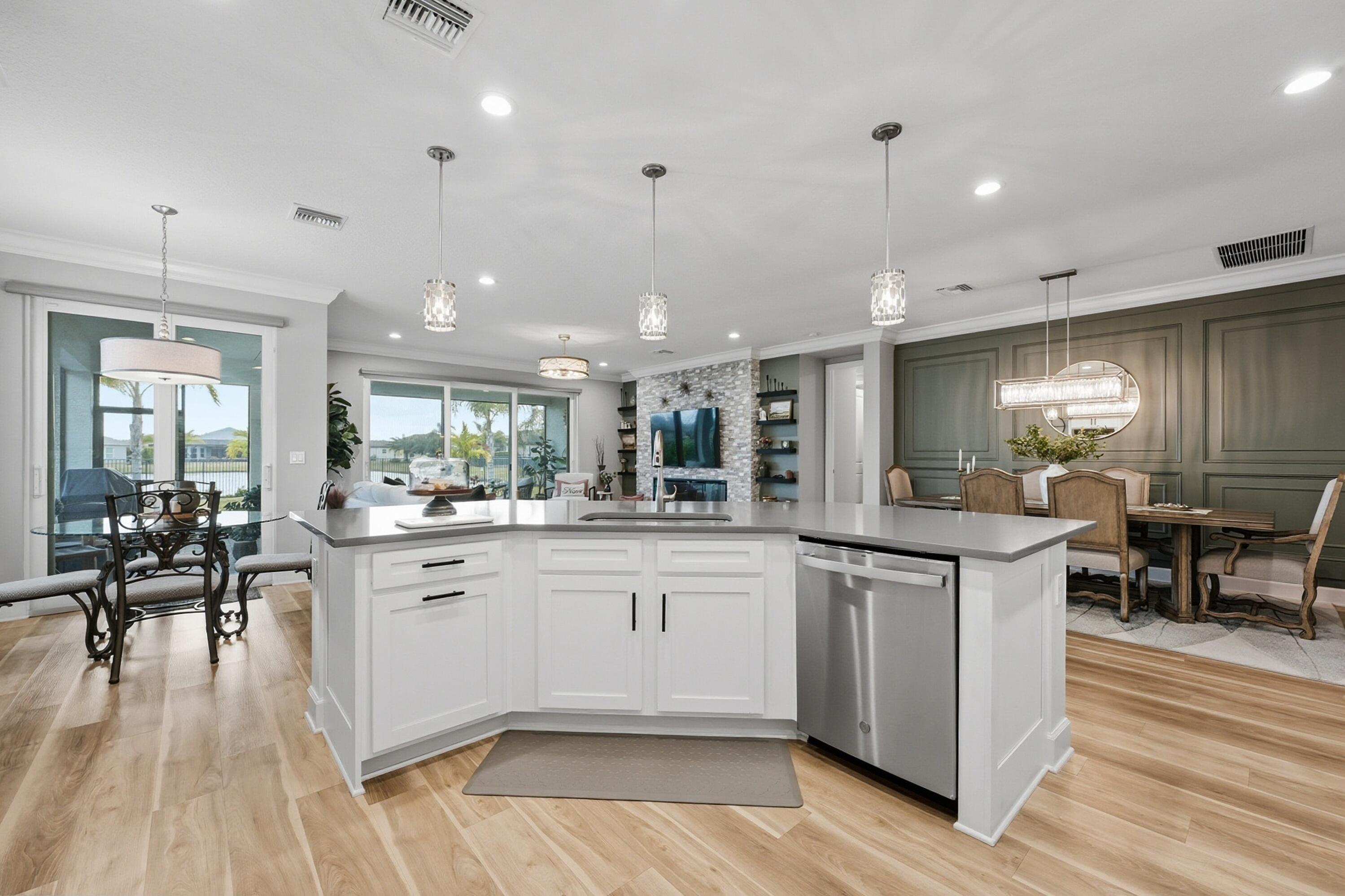 11784 Southwest Sailfish Isles Way Port St. Lucie, FL 34987 - Photo 15 of 77 a kitchen with lots of counter top space and living room