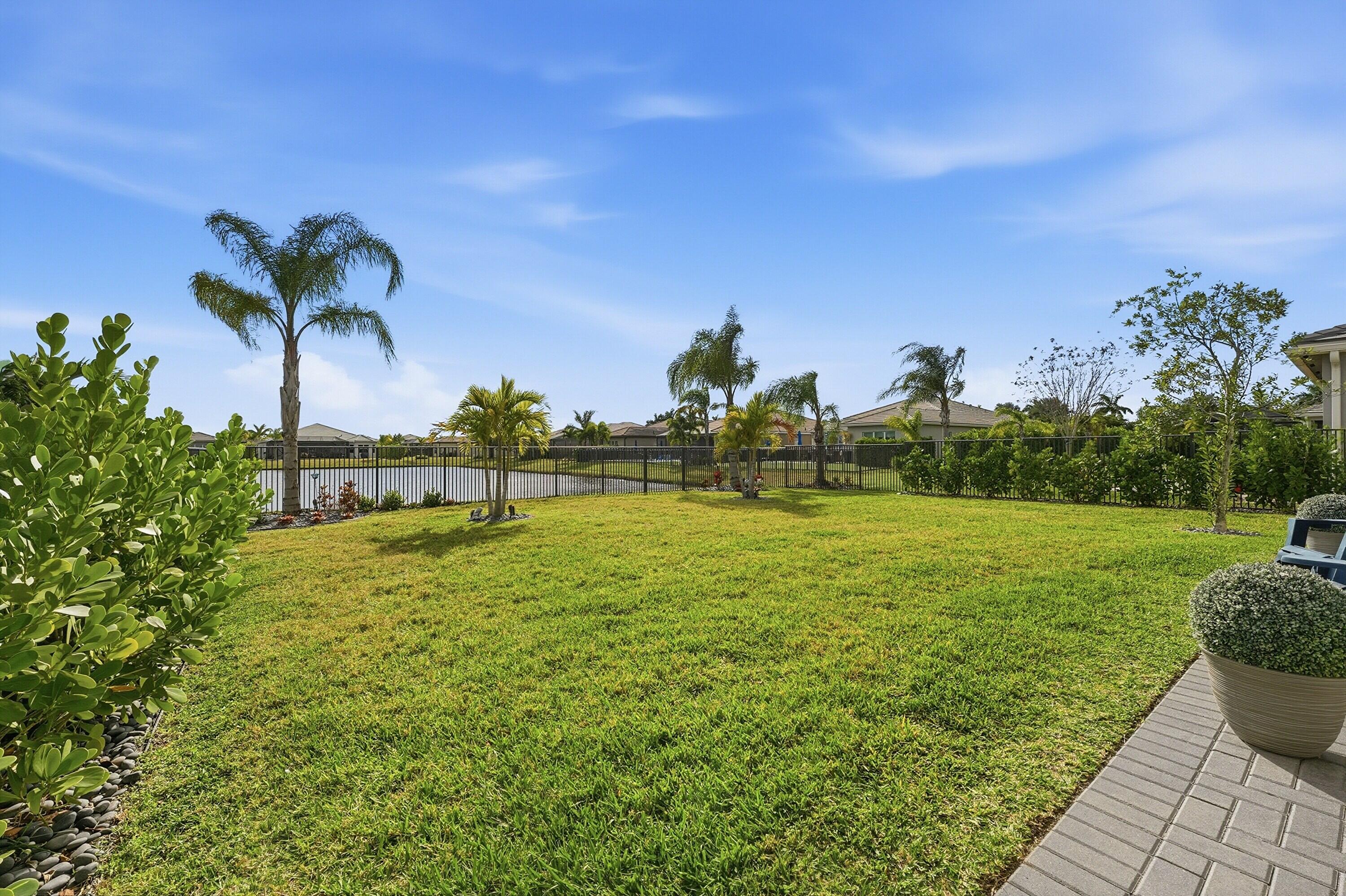 11784 Southwest Sailfish Isles Way Port St. Lucie, FL 34987 - Photo 33 of 77 a view of a garden
