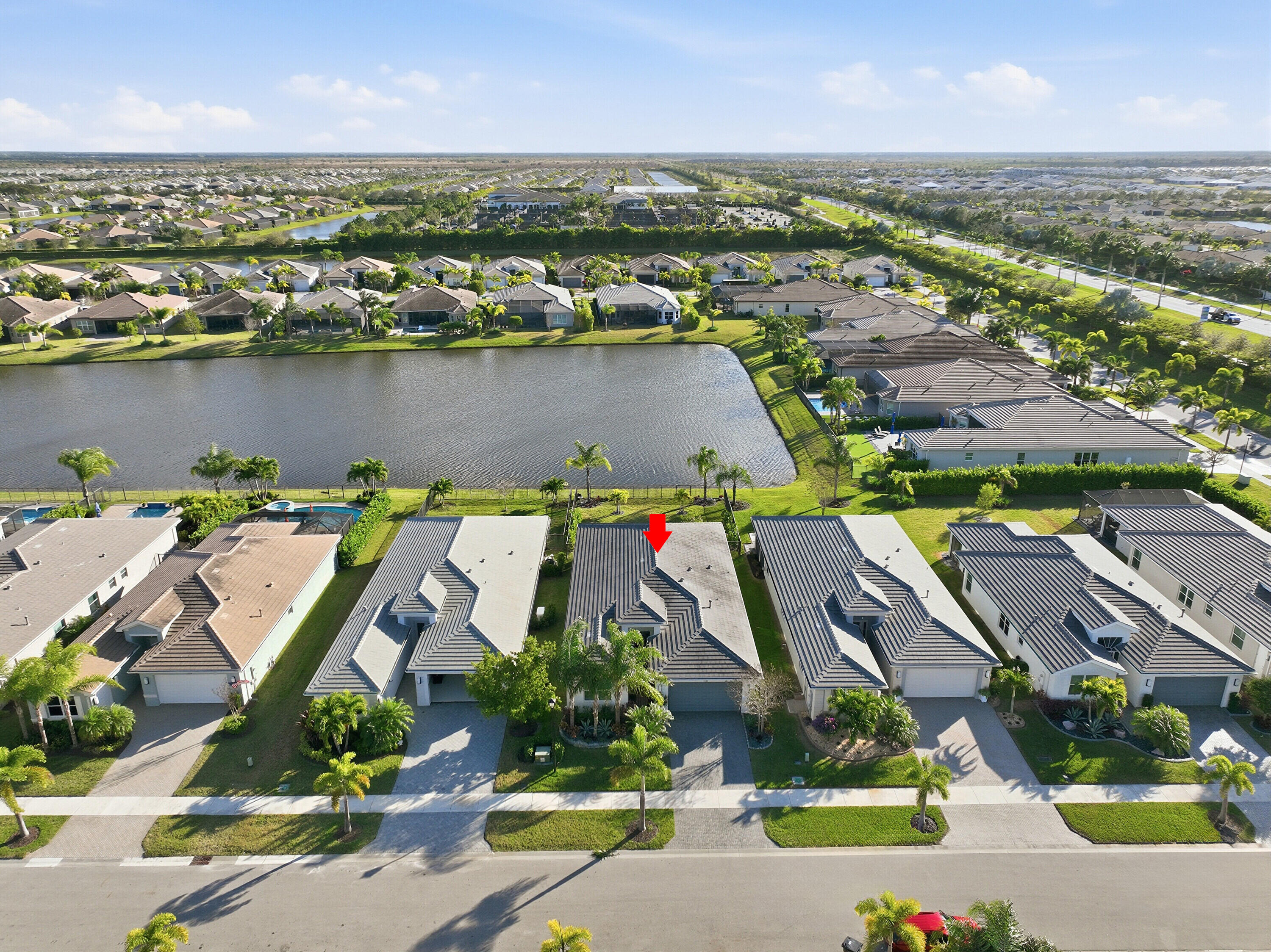 11784 Southwest Sailfish Isles Way Port St. Lucie, FL 34987 - Photo 36 of 77 an aerial view of residential houses with outdoor space and swimming pool
