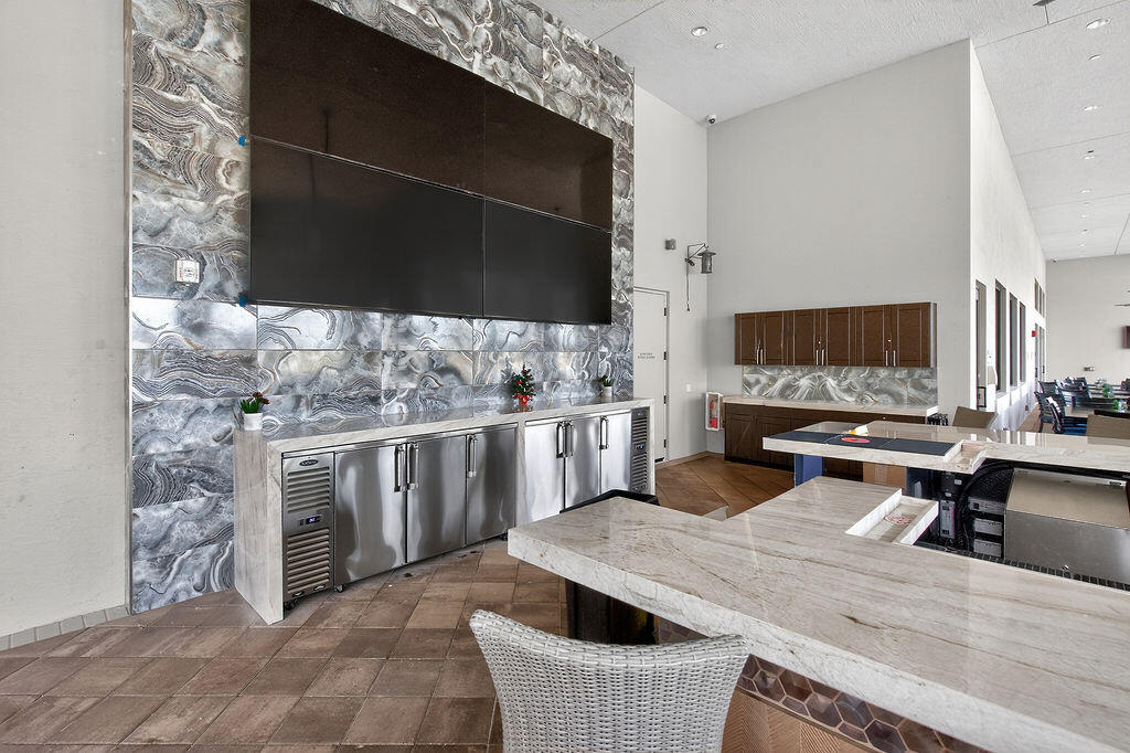 11784 Southwest Sailfish Isles Way Port St. Lucie, FL 34987 - Photo 45 of 77 a living room with stainless steel appliances kitchen island granite countertop a sink and a stove