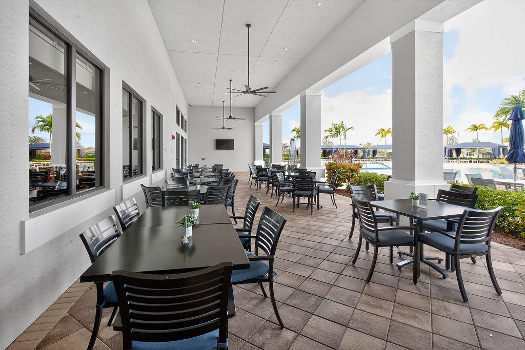 11784 Southwest Sailfish Isles Way Port St. Lucie, FL 34987 - Photo 48 of 77 a view of a dining room with furniture window and outside view