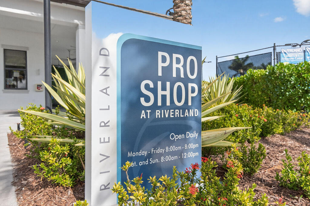 11784 Southwest Sailfish Isles Way Port St. Lucie, FL 34987 - Photo 58 of 77 a sign that is next to a building