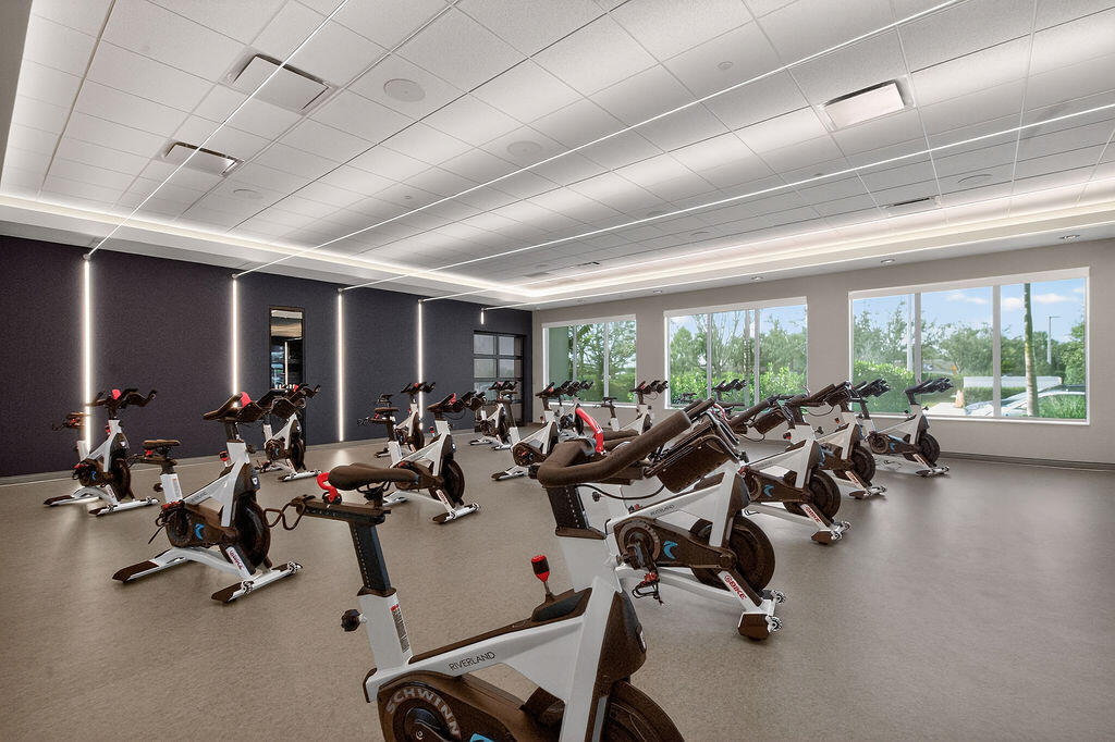 11784 Southwest Sailfish Isles Way Port St. Lucie, FL 34987 - Photo 66 of 77 a room with gym equipment and a large window