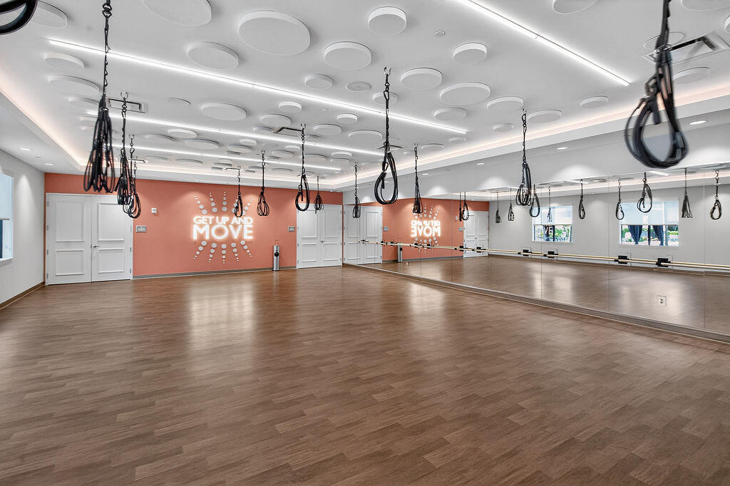 11784 Southwest Sailfish Isles Way Port St. Lucie, FL 34987 - Photo 68 of 77 a view of a room with lots of wooden floors